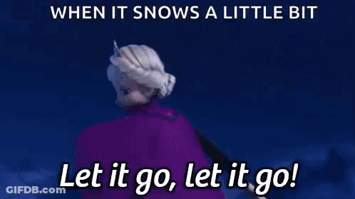 Elsa From The Movie Frozen Is Holding A Snowflake In Her Hand . GIF