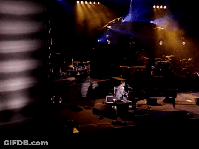 Elton John Kicking Chair While Playing Piano GIF