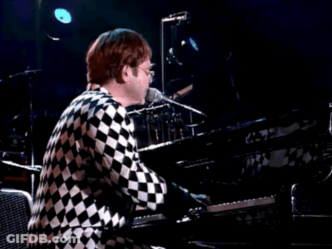 Elton John Singing On Microphone GIF