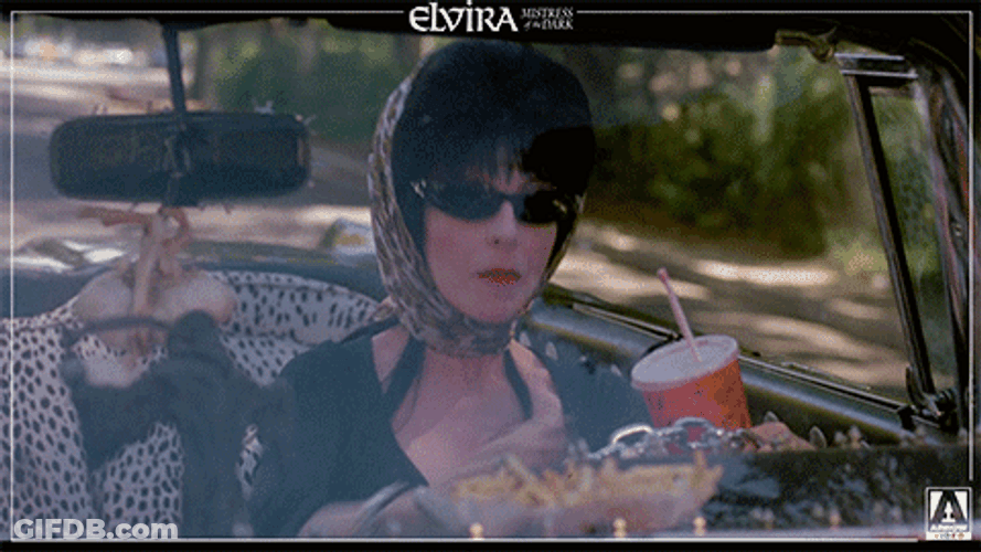 Elvira Cheering While Driving GIF