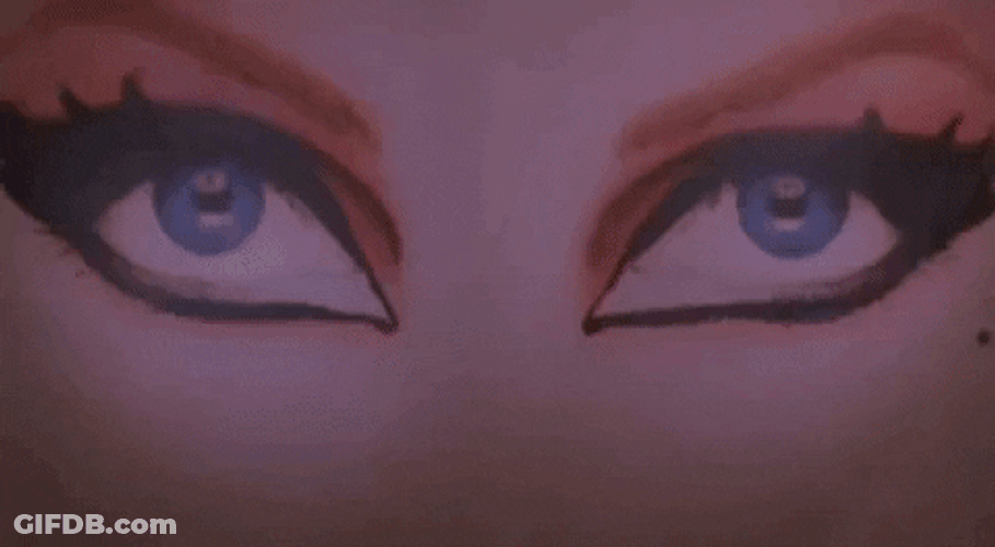 Elvira Making Her Way Through A Poster GIF