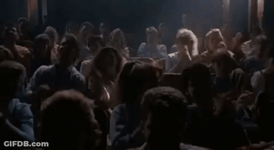 Elvira On Stage With A Spotlight GIF