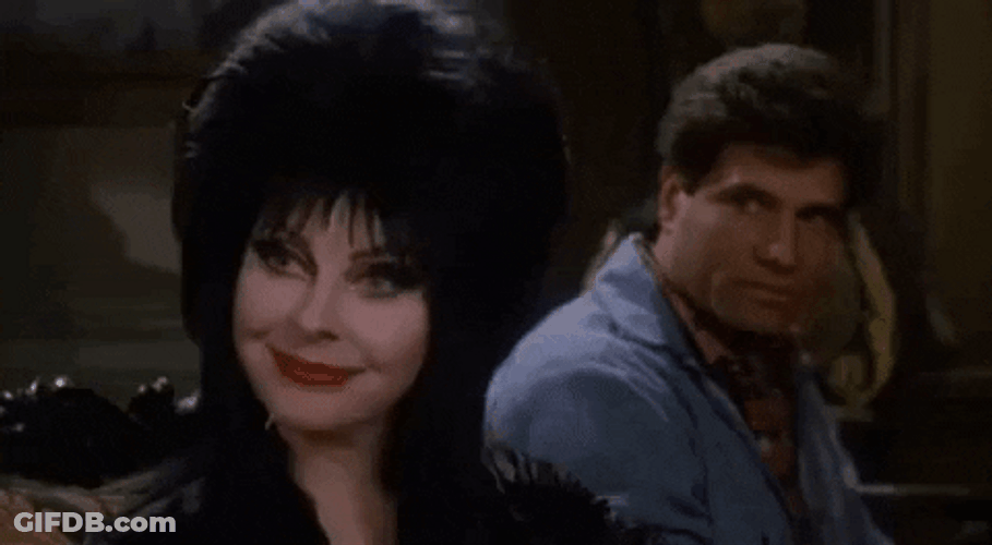 Elvira Sitting Next To Bob Redding GIF