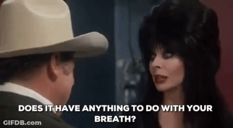 Elvira Talking To A Man GIF