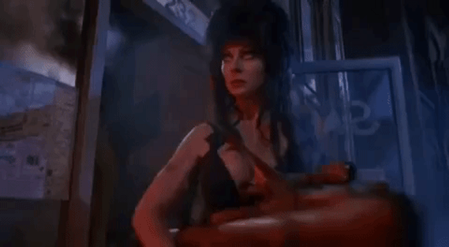 Elvira Using A Big Gun GIF