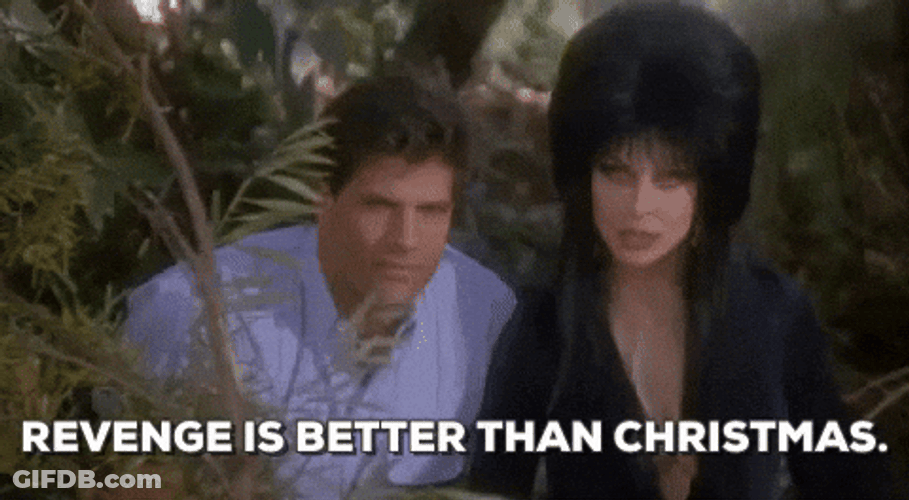 Elvira With Bob Redding In The Bushes GIF