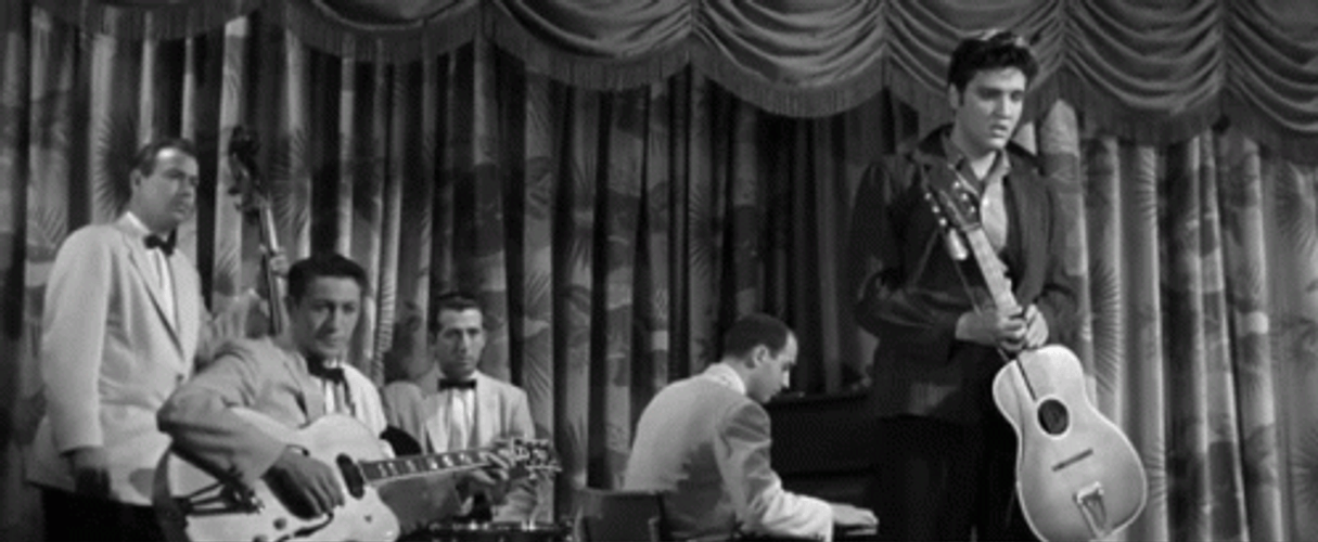 Elvis Destroying Guitar Off Stage Film Clip GIF