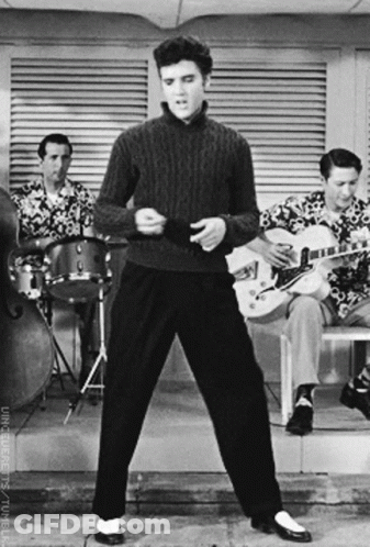 Elvis Presley Is Dancing In Front Of A Band GIF