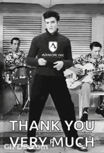 Elvis Presley Is Wearing An Armor Ink Shirt And Is Dancing In Front Of A Band GIF