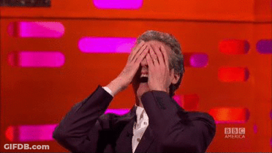 Embarrassed Laughing Reaction Peter Capaldi GIF
