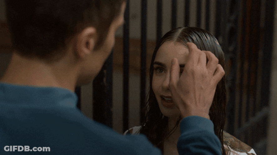 Emily In Paris Gabriel Fixing Emily's Hair GIF