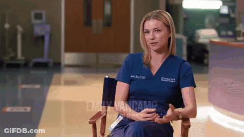 Emily Vancamp Sits In Chair In Hospital Room GIF