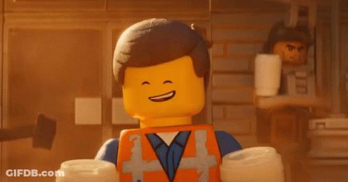 Emmett From The Lego Movie Smiling Holding Headphones Over Head GIF