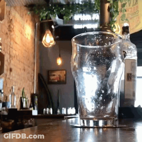 Empty Glass On Coaster At Restaurant Counter GIF