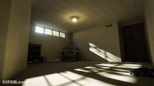 Empty Room With Chair And Light On GIF