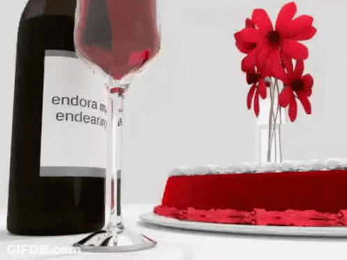 Endora Wine Bottle Next To Wine Glass And Cake GIF