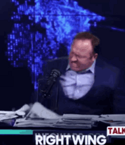 Enraged Alex Jones Hitting Table GIF