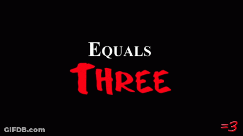 Equals Three Man Standing In Front Of Photo Wall GIF