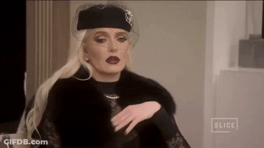 Erika Jayne Brushing Off Nonchalant Reaction GIF