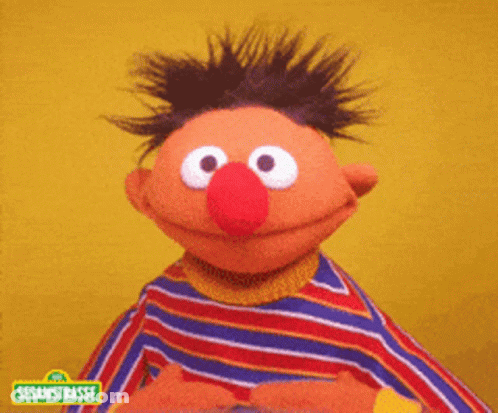 Ernie From Sesame Street Smiling Yellow Background GIF