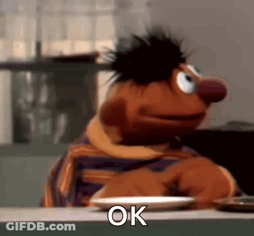 Ernie Sitting At Table With Plate Of Food GIF