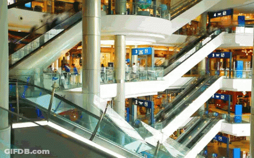 Escalator In Mall With B Sign GIF