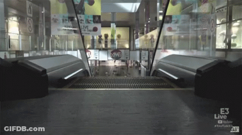 Escalator In Mall With E3 Live Sign GIF