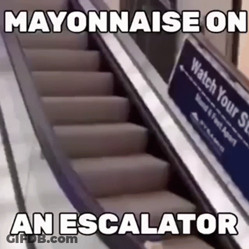 Escalator With Watch Your Step Sign GIF