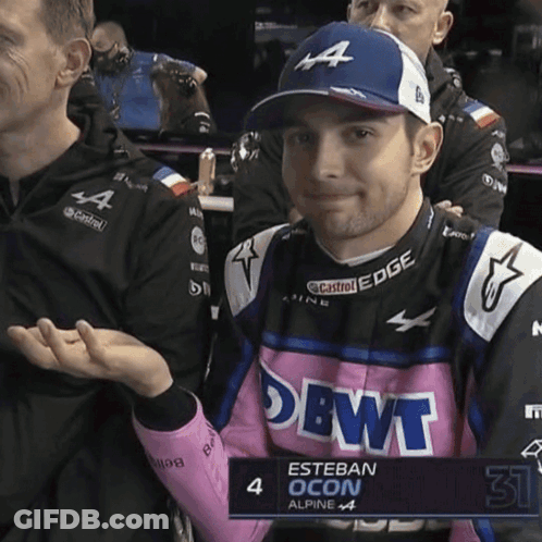 Esteban Ocon In Pink And Blue Alpine Outfit GIF