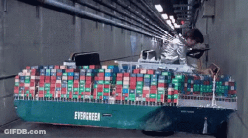 Evergreen Container Ship Model Pulled Through Tunnel GIF