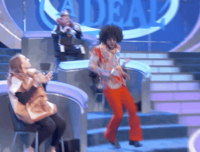 Excited Afro Haired Guy Quick Turn GIF