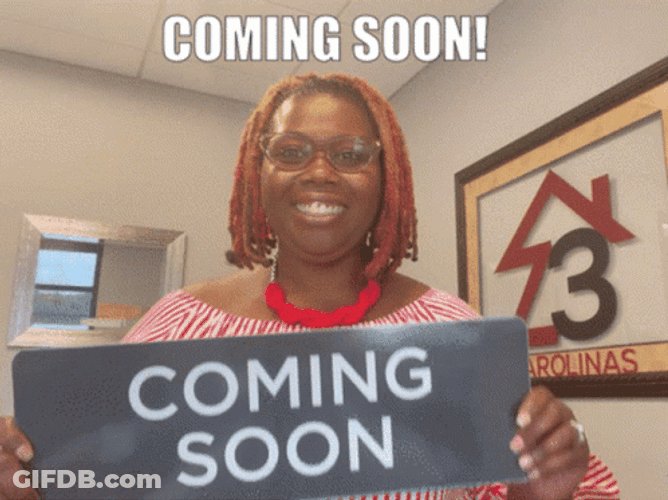 Excited Lady Showing Coming Soon Sign GIF