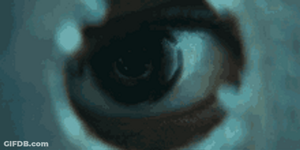 Eyeball Looking Through A Hole GIF