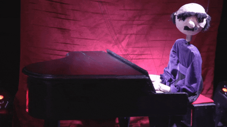 Eyebrows Raise Perfoming Puppet Show GIF
