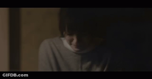 Face With Bandage In Dark GIF