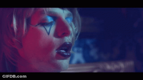 Face With Red And Blue Light Behind GIF