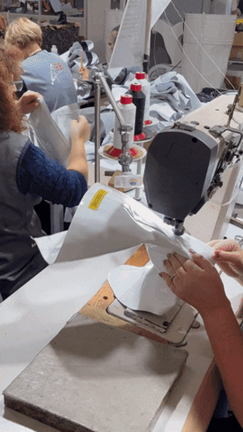 Factory Employers Making Boots GIF