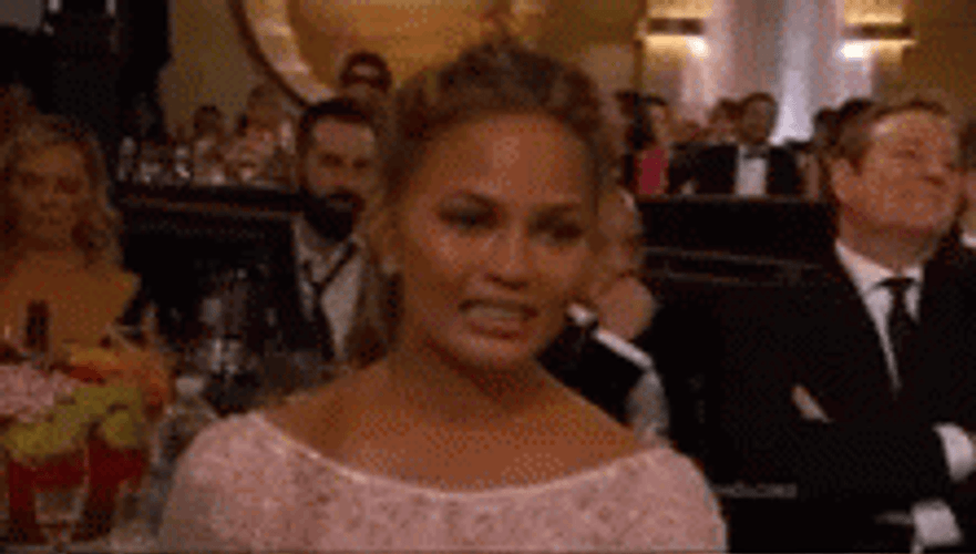 Fake Smile Chrissy Teigen GIF