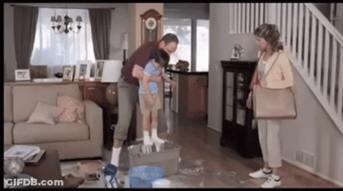 Family In Living Room With Couch And Stairs GIF