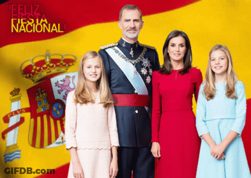 Family Posing In Front Of Spanish Flag Feliz Fiesta Nacional GIF