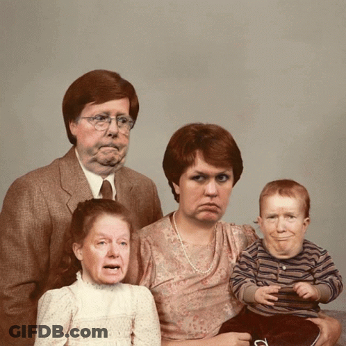 Family Posing With Drawn Faces GIF