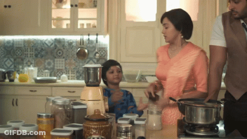 Family Preparing Food In Kitchen With Blender And Pots GIF