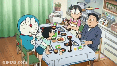 Family Sitting Around Table With Doraemon GIF