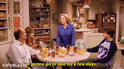 Family Sitting At Kitchen Table GIF