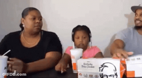 Family Sitting At Table With KFC GIF