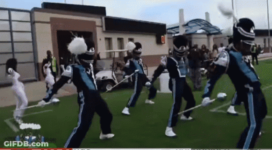 Famu Marching 100 Band Members Holding Staff GIF