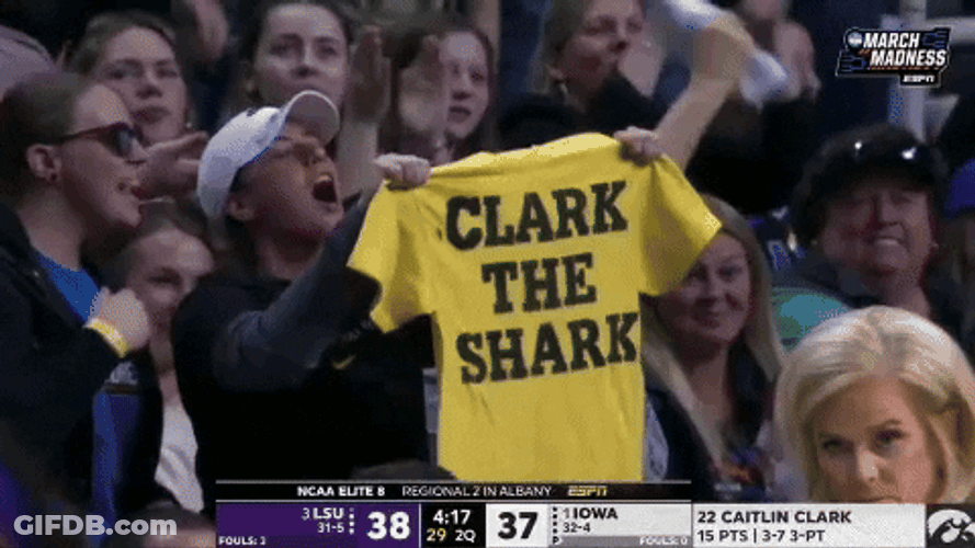 Fan Displaying Caitlin Clark Jersey GIF