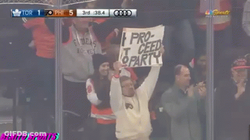 Fan Holds Sign Saying Pro-Ceed Party GIF
