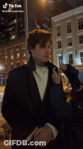Fan Signing Man In Suit GIF