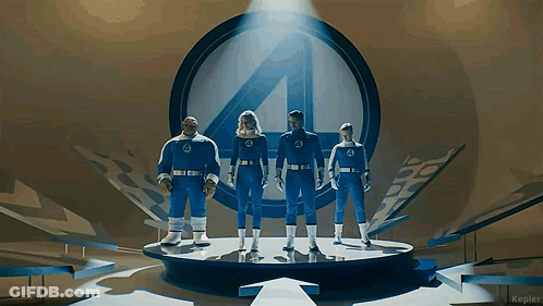 Fantastic Four Standing On Stage In Front Of Number 4 GIF